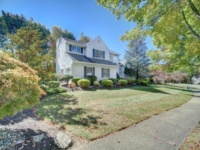 view of front of home with a front lawn