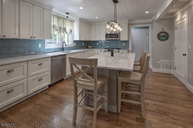 kitchen featuring appliances with stainless steel finishes, visible vents, recessed lighting, and white cabinetry