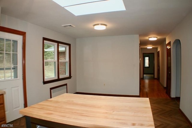 461 Main St, Sparta Twp, NJ 07871 - unfurnished dining area featuring radiator heating unit, a skylight, and visible vents