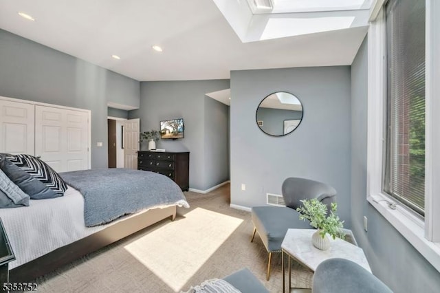 carpeted bedroom with recessed lighting, a skylight, visible vents, and baseboards