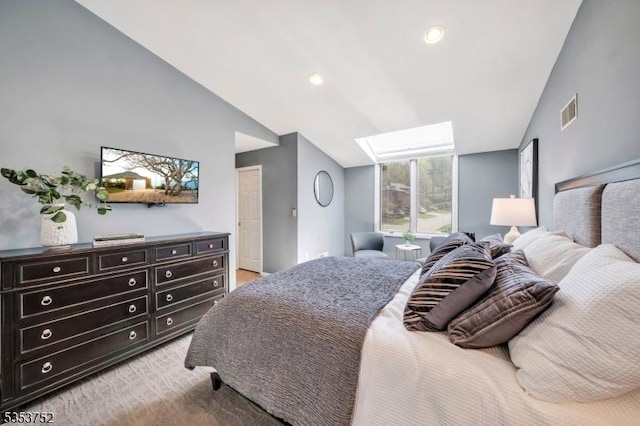 bedroom with recessed lighting, visible vents, light carpet, and lofted ceiling with skylight