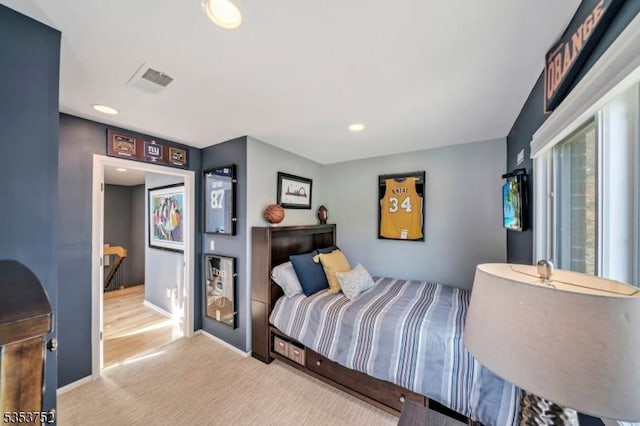 carpeted bedroom with recessed lighting, baseboards, and visible vents
