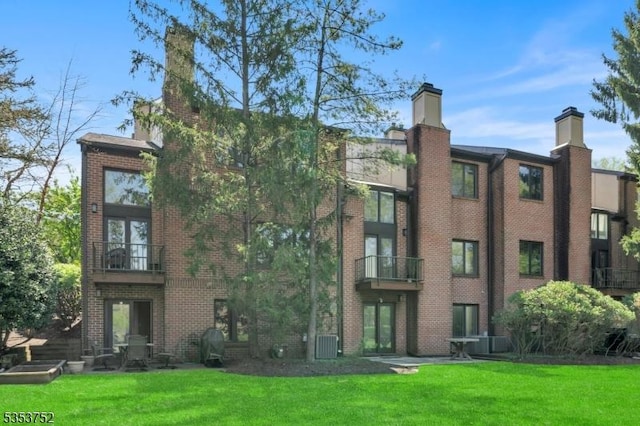 view of property featuring central AC unit