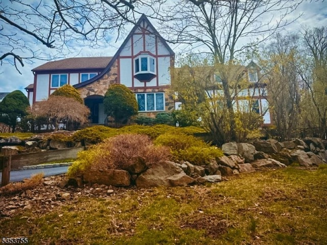 exterior space featuring stone siding