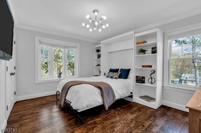 bedroom with baseboards, ornamental molding, multiple windows, and a chandelier
