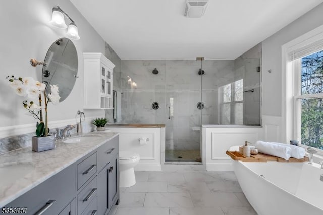 bathroom featuring a sink, a shower stall, a healthy amount of sunlight, and marble finish floor