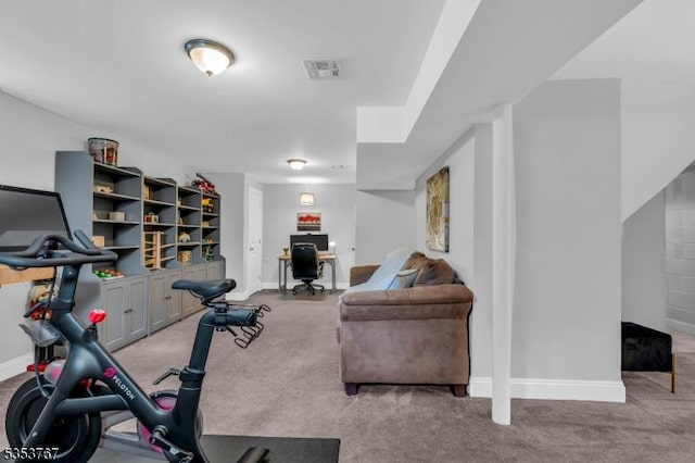workout room with baseboards, light colored carpet, and visible vents