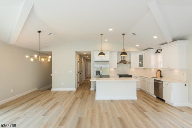 kitchen featuring stainless steel appliances, decorative backsplash, light wood-type flooring, wall chimney range hood, and lofted ceiling
