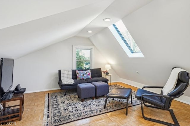 sitting room featuring vaulted ceiling, a skylight, baseboards, and recessed lighting