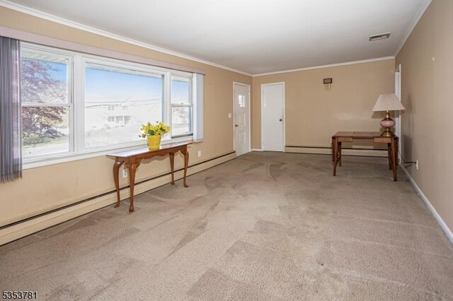 foyer with visible vents, ornamental molding, a baseboard heating unit, and light colored carpet