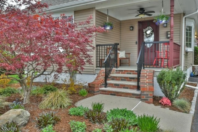 property entrance with covered porch and a ceiling fan