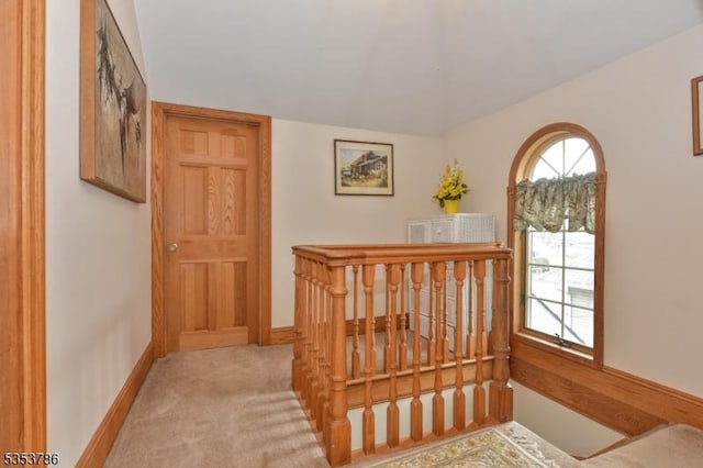 interior space with baseboards and carpet