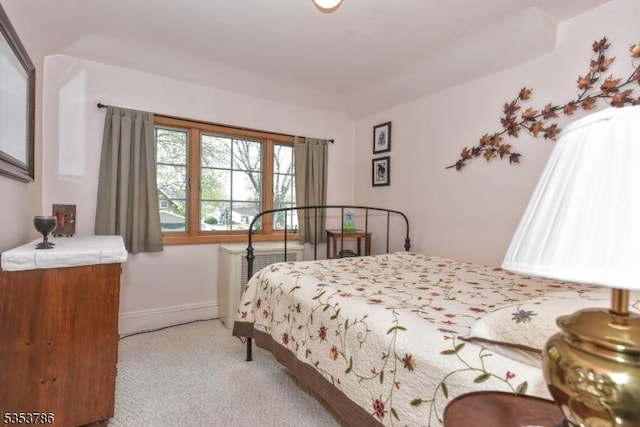 bedroom featuring carpet floors and baseboards