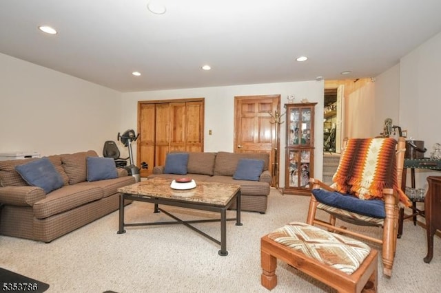 living room featuring light carpet and recessed lighting