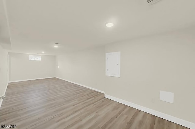 basement featuring wood finished floors, recessed lighting, and baseboards
