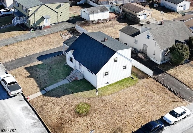 birds eye view of property with a residential view