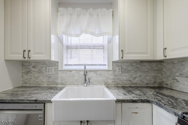 kitchen with white cabinetry, tasteful backsplash, a sink, and dishwasher