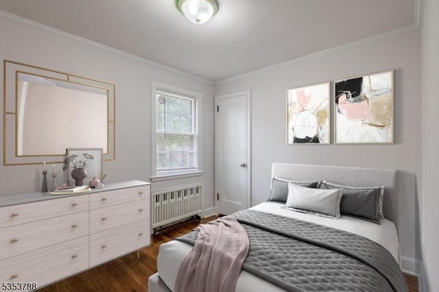 bedroom featuring crown molding, dark wood-style flooring, baseboards, and radiator