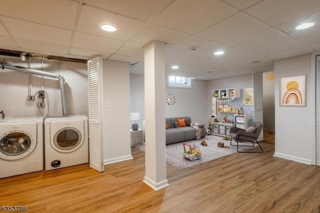 laundry room with baseboards, recessed lighting, laundry area, and wood finished floors