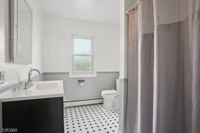 full bathroom with a baseboard radiator, toilet, vanity, tile patterned flooring, and a shower with curtain