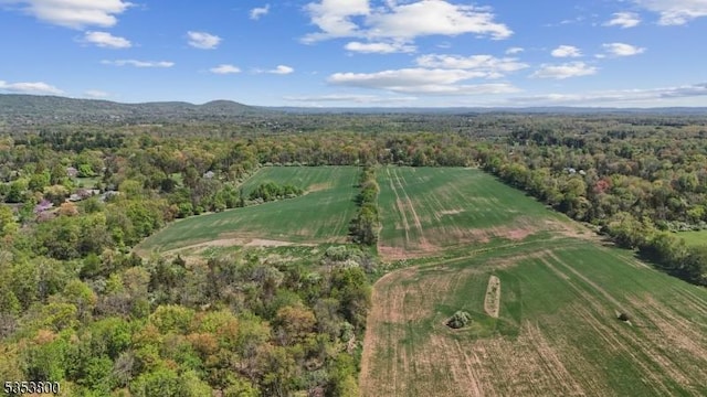 aerial view of property's location with a forest and rural landscape