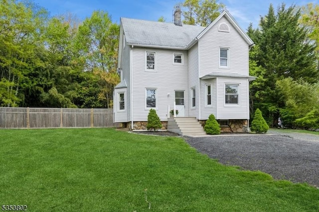 590 Valley Rd, Long Hill Twp, NJ 07933 - view of front facade with a chimney, a front yard, and fence