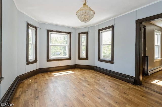 590 Valley Rd, Long Hill Twp, NJ 07933 - unfurnished room with an inviting chandelier, ornamental molding, wood-type flooring, and a baseboard radiator