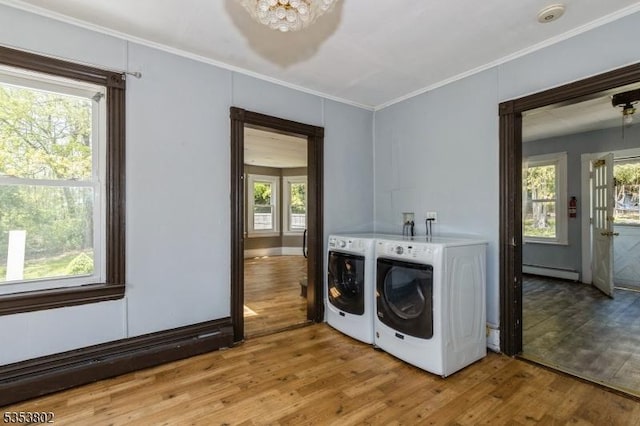 590 Valley Rd, Long Hill Twp, NJ 07933 - laundry room with washer and dryer, an inviting chandelier, wood finished floors, crown molding, and a baseboard heating unit