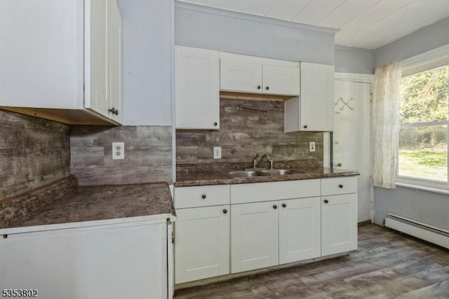 590 Valley Rd, Long Hill Twp, NJ 07933 - kitchen featuring a sink, a wealth of natural light, white cabinetry, and tasteful backsplash