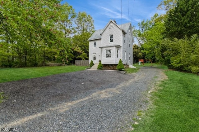 590 Valley Rd, Long Hill Twp, NJ 07933 - view of front facade featuring driveway and a front yard