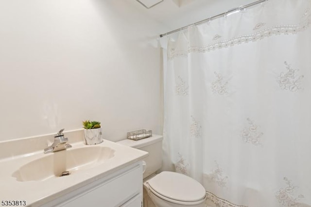 full bathroom with vanity, curtained shower, and toilet