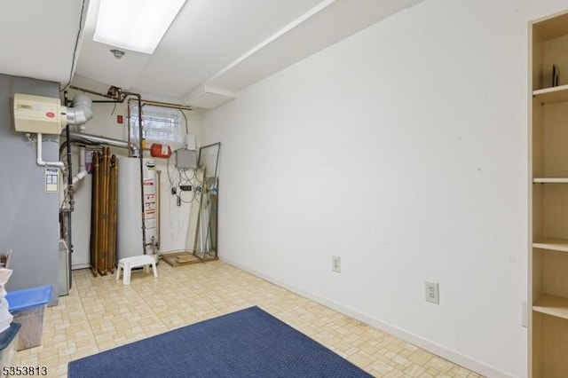 finished basement with tile patterned floors and gas water heater