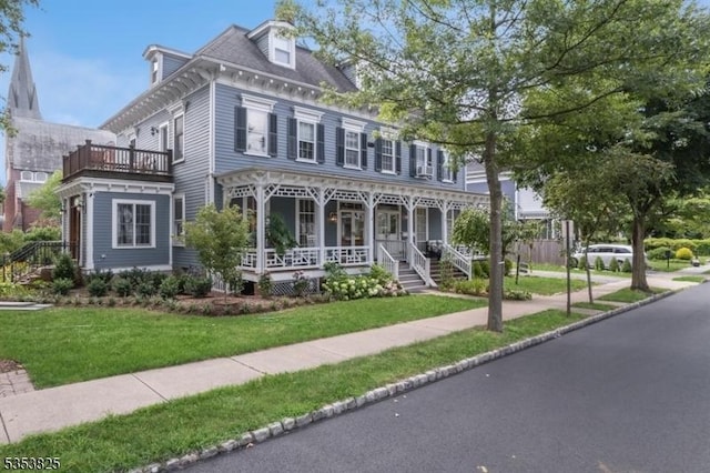 2 Perry St, Morristown Town, NJ 07960 - view of front of house featuring a porch, a front lawn, and a balcony