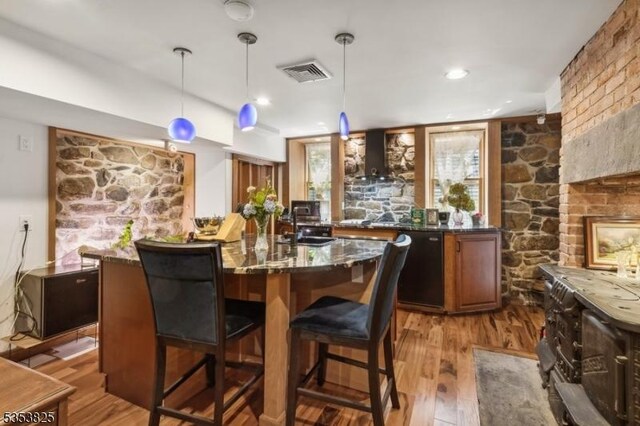 2 Perry St, Morristown Town, NJ 07960 - bar featuring wood finished floors, visible vents, dishwasher, and wall chimney exhaust hood