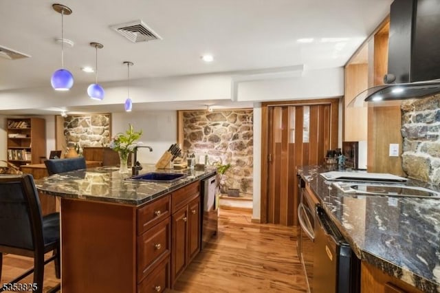 2 Perry St, Morristown Town, NJ 07960 - kitchen featuring a breakfast bar, light wood-type flooring, a sink, visible vents, and dishwashing machine