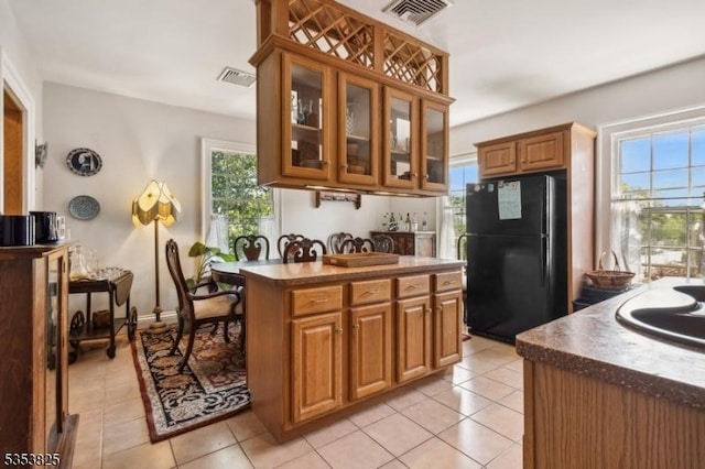 2 Perry St, Morristown Town, NJ 07960 - kitchen featuring light tile patterned floors, visible vents, and freestanding refrigerator