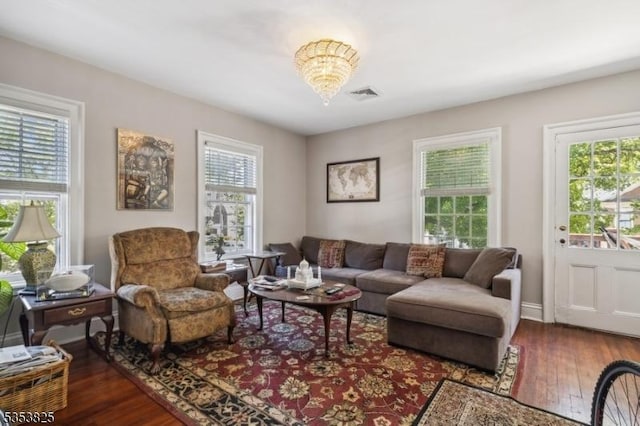 2 Perry St, Morristown Town, NJ 07960 - living room featuring a notable chandelier, visible vents, hardwood / wood-style floors, and a healthy amount of sunlight