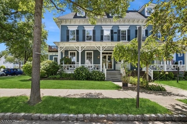 2 Perry St, Morristown Town, NJ 07960 - view of front of house with covered porch, a balcony, and a front lawn