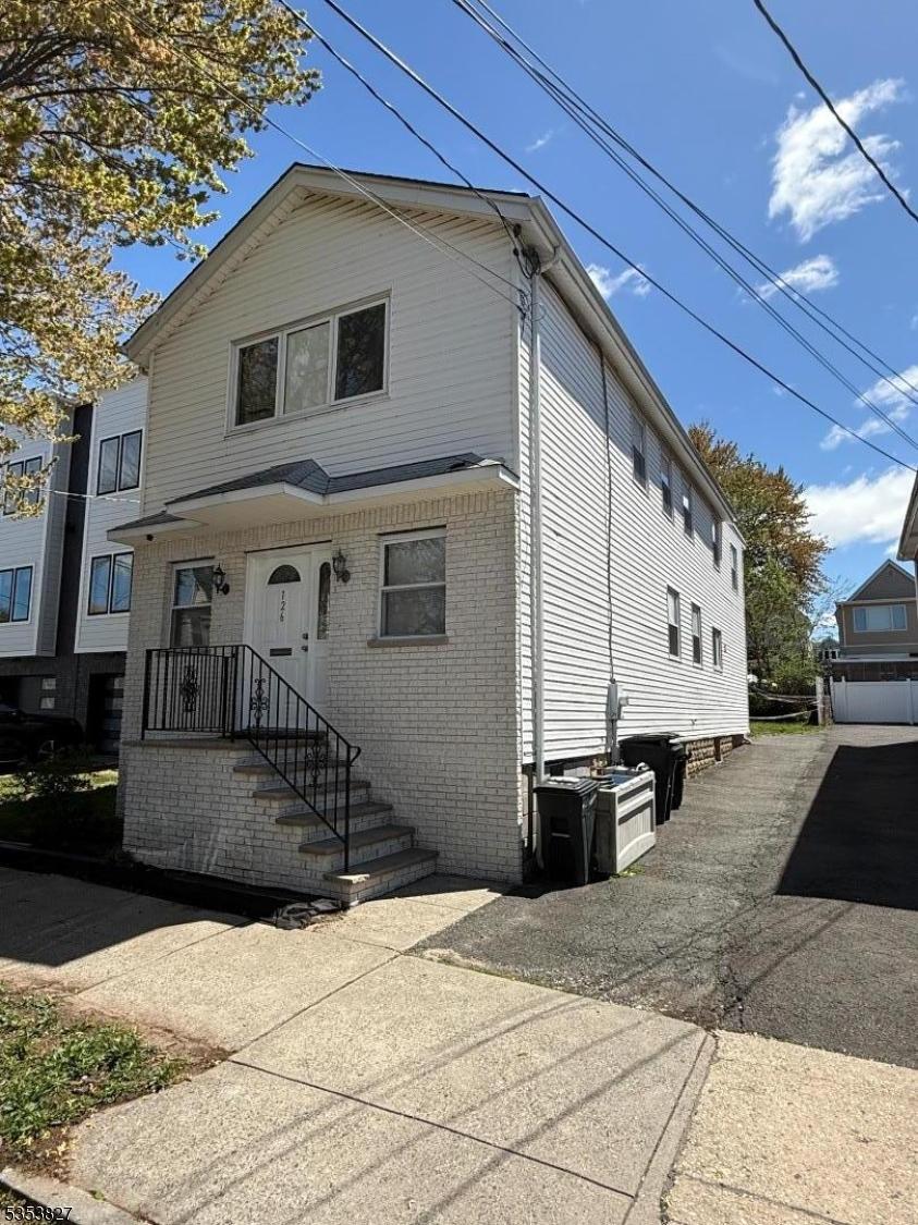 126 Brighton Ave, Kearny Town, NJ 07032 - view of front of house featuring brick siding