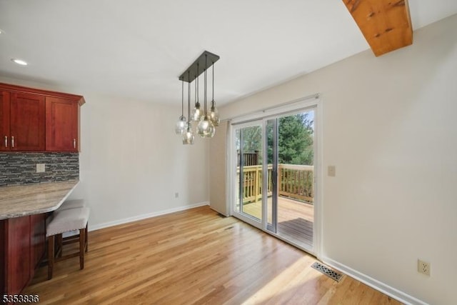 unfurnished dining area with baseboards, recessed lighting, visible vents, and light wood-type flooring