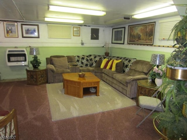 carpeted living area with heating unit