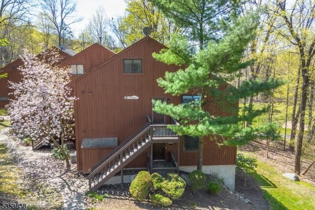 back of property with stairs