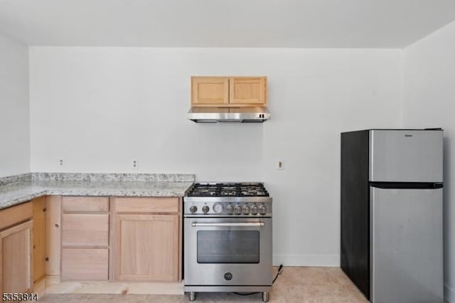 kitchen with light brown cabinetry, appliances with stainless steel finishes, baseboards, light stone counters, and under cabinet range hood