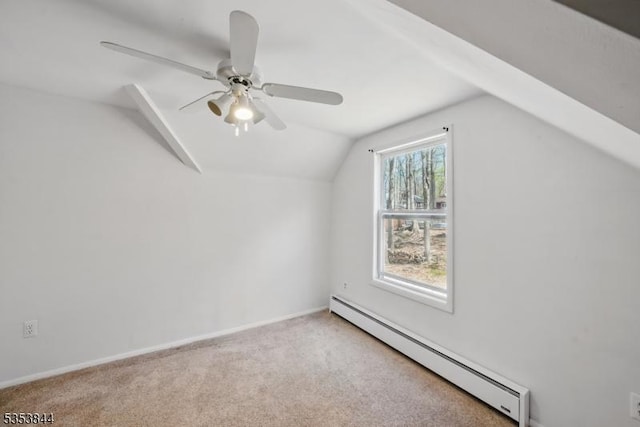 bonus room featuring baseboards, ceiling fan, baseboard heating, carpet, and vaulted ceiling