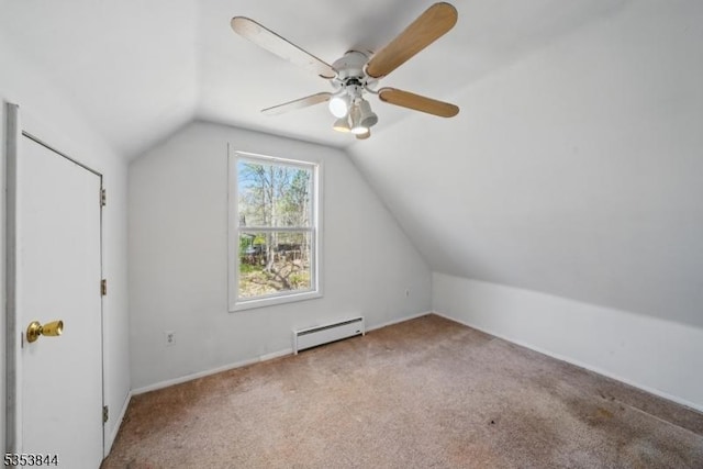 additional living space with a ceiling fan, a baseboard heating unit, carpet flooring, and lofted ceiling