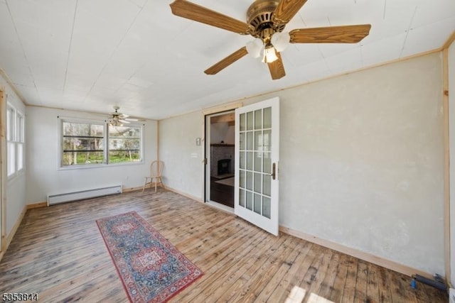 unfurnished sunroom featuring a baseboard radiator