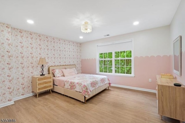 bedroom with baseboards, recessed lighting, light wood-style flooring, and wallpapered walls