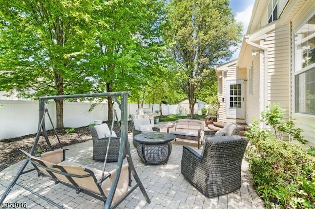 view of patio / terrace with an outdoor living space and a fenced backyard