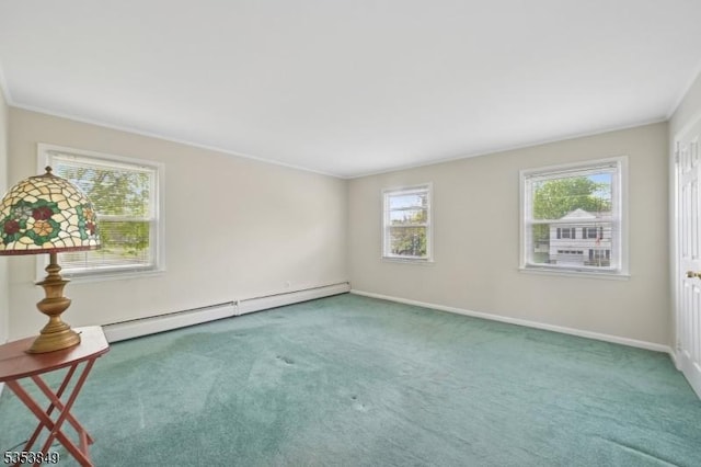 spare room with plenty of natural light, a baseboard radiator, and carpet flooring
