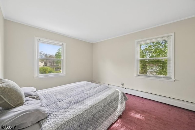 bedroom featuring carpet flooring, crown molding, and a baseboard heating unit